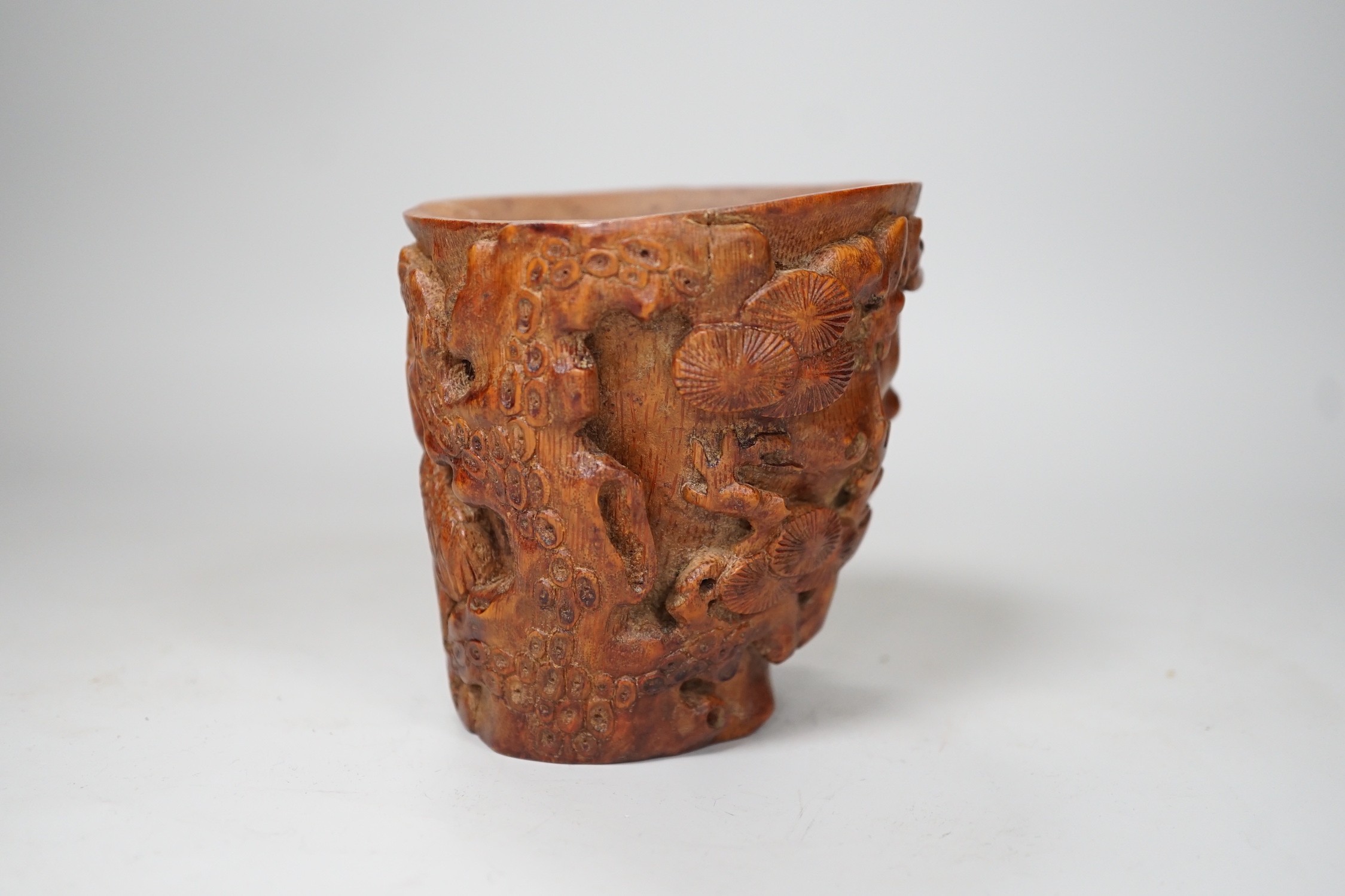 A Chinese bamboo libation cup. 10cm tall